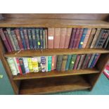 TWO SHELVES OF ANTIQUE AND VINTAGE FICTION BOOKS.