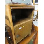 AN OAK VENEERED CHEST OF THREE DRAWERS WITH MIRROR, TOGETHER WITH AN OAK BEDSIDE CUPBOARD. *