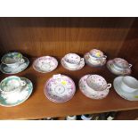 SELECTION OF 19TH CENTURY FLORAL PATTERN TEA CUPS AND SAUCES. (AF)