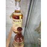 BELLS OLD SCOTCH WHISKY ONE LITRE BOTTLE, TOGETHER WITH A BELLS WADE CHINA BELL DECANTER WITH