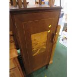 BANDED MAHOGANY SINGLE DOOR CUPBOARD WITH INLAY, STANDING ON BRASS CASTERS.