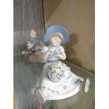 TWO NADAL SPANISH PORCELAIN FIGURES; GIRL WITH FLOWERS AND GIRL WITH PUPPIES AND FLOWERS.