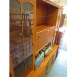 TEAK VENEERED ILLUMINATED LOUNGE DRESSER. *