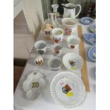 A SELECTION OF CRESTED CHINA INCLUDING EGG CUPS, PIN DISHES , PEPPER SHAKER AND OTHER ITEMS.