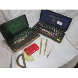 TWO CASED SETS OF DRAWING INSTRUMENTS. (AF) GOLD PLATED PROPELLING PENCIL AND OTHER SMALL ITEMS.