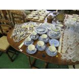 OAK OVAL DROP LEAF DINING TABLE TOGETHER WITH TWO LADDER BACK CHAIRS. *