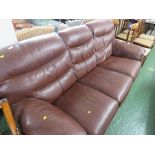 BROWN FAUX LEATHER THREE SEATER SOFA. *