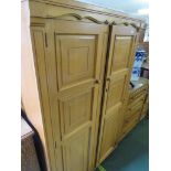 A LOCK OF LONDON LIGHT OAK BEDROOM SET COMPRISING OF A TWO DOOR FITTED WARDROBE , ONE OTHER TWO DOOR
