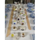 A SELECTION OF MINIATURE CRESTED CHINA INCLUDING CUPS , YEWERS AND CRUET SET.