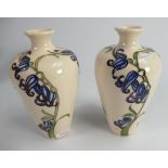 Moorcroft pair of vases decorated in a floral design: dated 2009, height 16.5cm.