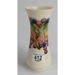 Walter Moorcroft vase decorated in the leaf & berry design on cream ground: height 17.5cm.