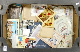 A mixed collection of items to include: vintage postcards, cigarette cards,