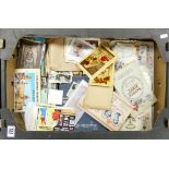 A mixed collection of items to include: vintage postcards, cigarette cards,