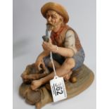 Capodimonte parian figure of a seated fisherman: height 19.5cm.