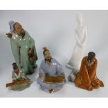 A collection of Oriental stoneware character figures of men: and a Spode white figure,