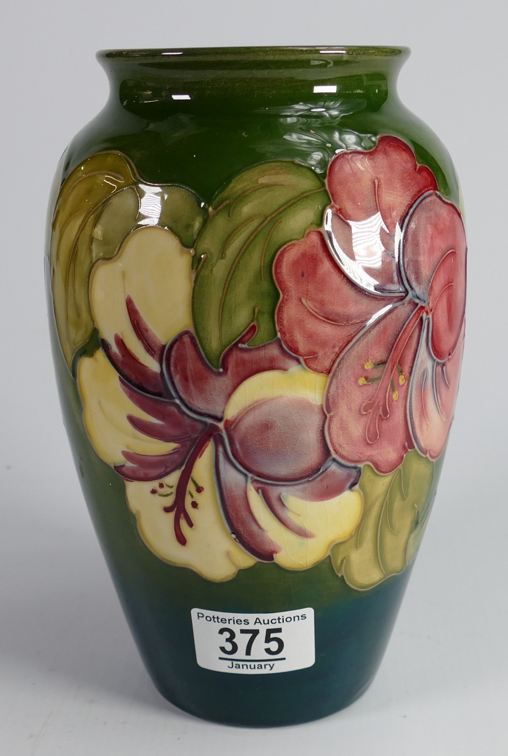 Walter Moorcroft vase in the hibiscus design: height 21cm.