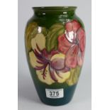 Walter Moorcroft vase in the hibiscus design: height 21cm.