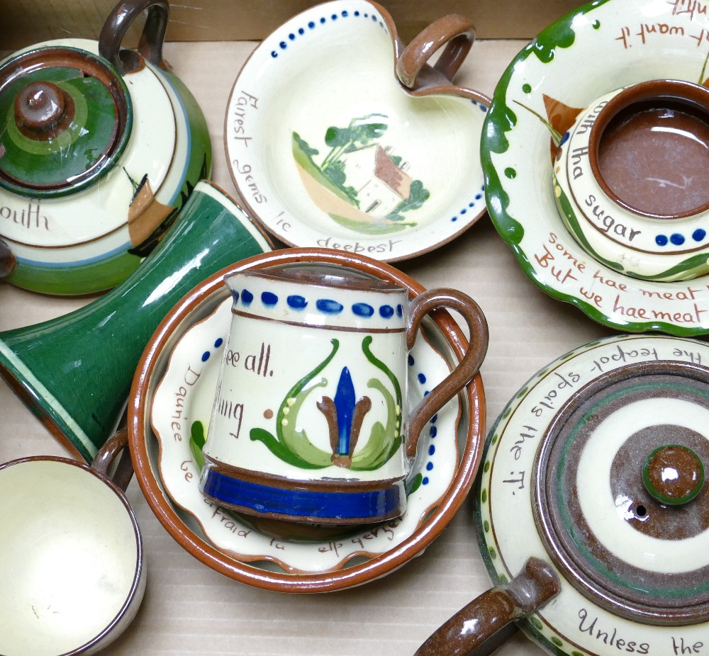 A collection of Devon Motto ware to include: Teapot, bowls, ashtray etc.