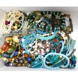 Collection of costume jewellery mainly beads in a shoe box: