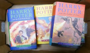 A collection of Harry Potter books: including three paperback and four hardback editions.