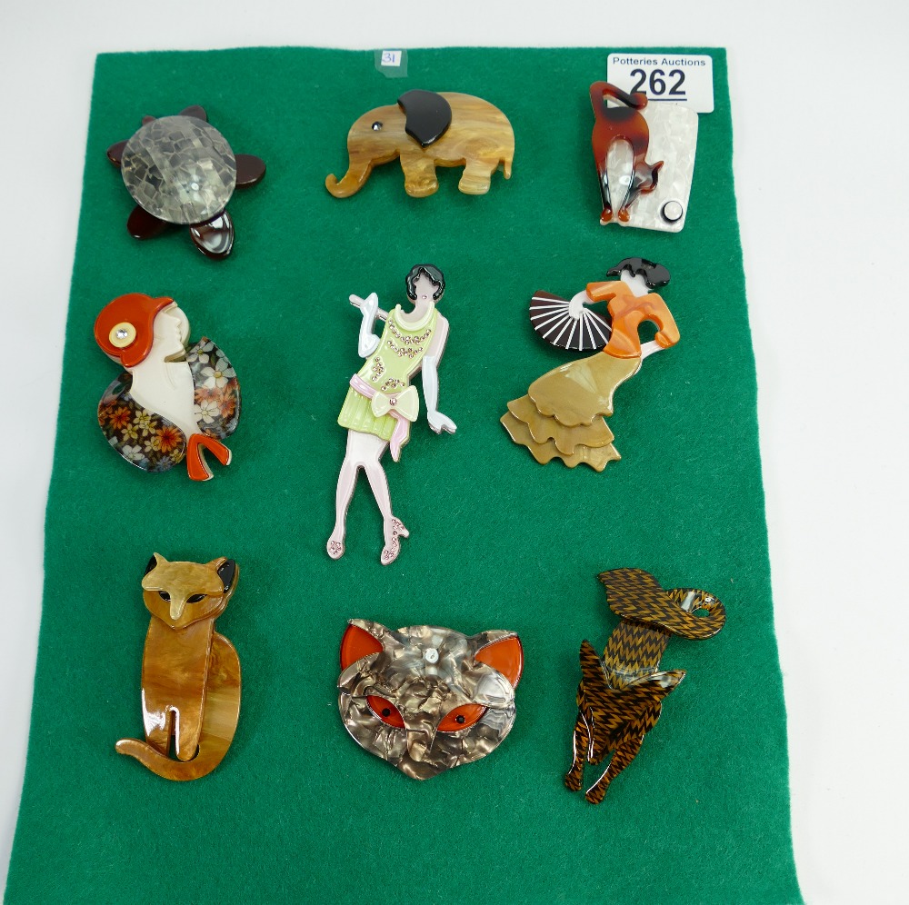 A set of nine modern brooches: (9)