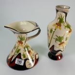 Black Ryden vase and ewer decorated with flowers: tallest height 26cm.