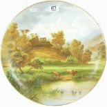 Earthenware charger handpainted with Cattle outside Norham castle: early 20th century,