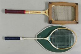 Vintage wooden tennis racket and press together with a badminton racket: