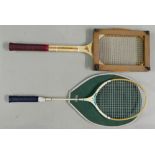 Vintage wooden tennis racket and press together with a badminton racket: