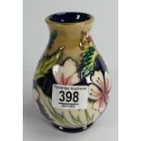 Moorcroft vase decorated in a floral design: dated 1999, height 14cm.