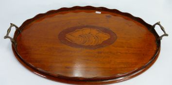Satinwood Sheraton style oval tea tray: Inlaid with shell decoration and brass handles.