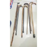 A collection of early 20th century Canes and handled walking sticks etc.