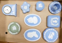 A collection of Wedgwood blue jasper ware items to include: mantle clock, wall plaques,