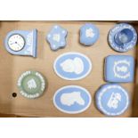 A collection of Wedgwood blue jasper ware items to include: mantle clock, wall plaques,