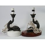 Two Wedgwood black basalt jasperware dolphin table lamps: The property of Carl Moss,