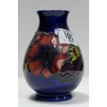 Moorcroft Clematis vase: on blue ground.