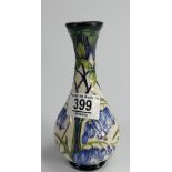 Moorcroft vase decorated in a floral design: for James Macintyre. dated 1997, height 17cm.