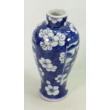 Chinese blue and white vase: Prunus background, panels with oriental scenes. 19cm high.