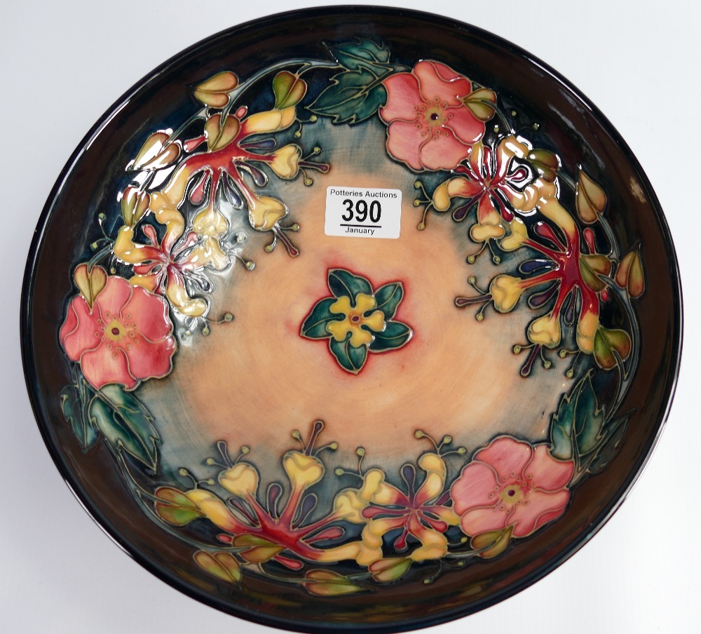 Moorcroft large fruit bowl decorated in the Oberon design: dated 1993, diameter 28cm.