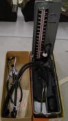 A vintage cased blood pressure testing unit: together with 2 stethoscopes.