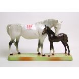 Beswick Mare and Foal on base:Beswick grey mare with dark brown foal on ceramic grass base model