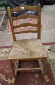Child's oak ladder back rocking chair: with rush seating