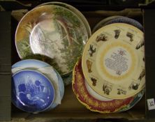 A mixed collection of decorative plaques: and wall plates