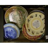 A mixed collection of decorative plaques: and wall plates