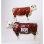 Beswick Hereford Bull and Hereford Cow: tip of one of the bull's horns is chipped (2).