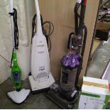 A Dyson DC33 vacuum: together with a Panasonic vacuum and a steam cleaner.