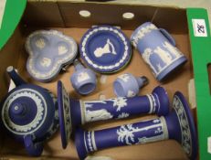 A collection of Wedgwood jasper ware: to include a pair of dark blue candlesticks ( chips to