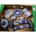 A collection of Wedgwood jasper ware: to include a pair of dark blue candlesticks ( chips to