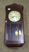 1930's Oak cased wall clock: with key and pendulum