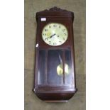 1930's Oak cased wall clock: with key and pendulum